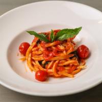 Maccaronara al Pomodoro · Maccaronara Pasta (Eggless Long Thick Spaghetti Made in House) With Tomato Sauce and Basil.