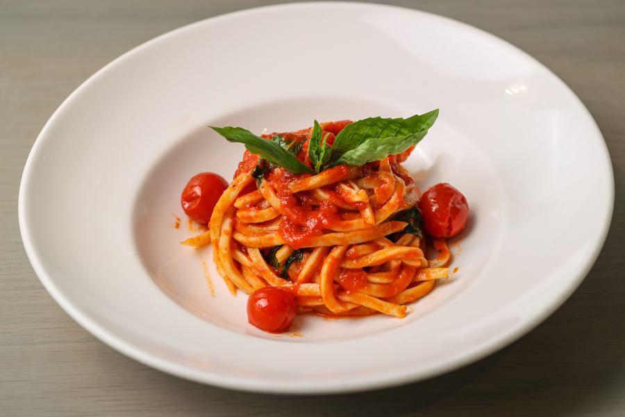 Maccaronara al Pomodoro · Maccaronara Pasta (Eggless Long Thick Spaghetti Made in House) With Tomato Sauce and Basil.