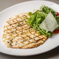 Paillard di Pollo · Pounded Organic Grilled Chicken Breast Served with Arugula and Cherry Tomato Salad.