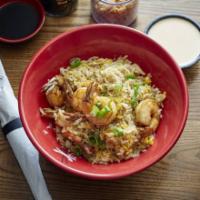 Hibachi Fried Rice · fried rice with onion corn and G onion with yum yum sauce