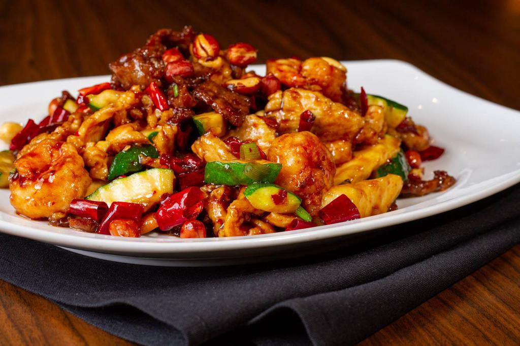 Kung Pao Supreme · Chicken, beef and shrimp, peanuts, chilli and green onion in our spicy kung pao sauce