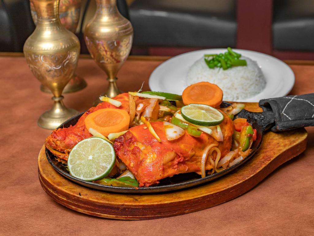 Tandoori Chicken Curry · Tender pieces of tandoori chicken mixed with our traditional curry sauce. Gluten free and nut free.