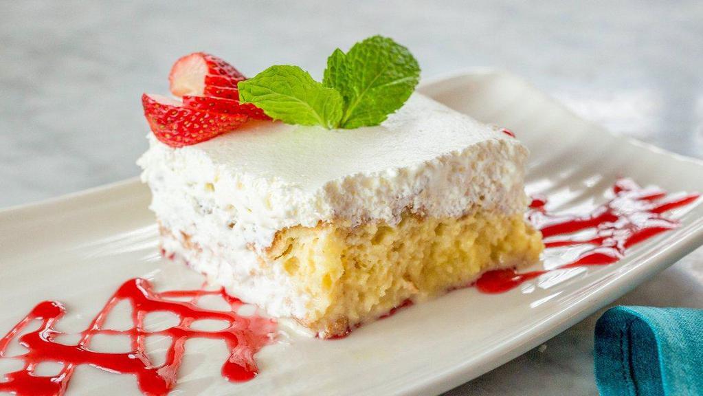 Tres Leches · Light sponge cake soaked in a sweet three milk mixture then topped with a whipped meringue and drizzled with a strawberry reduction
