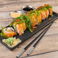 14. Alaska Special Roll · Salmon, cream cheese, and avocado, topped with salmon, seaweed salad and ikura.