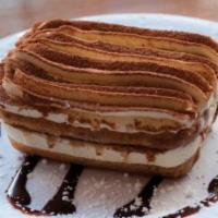 Tiramisu · Italian cookies (lady fingers) with thick layers of mascarpone cheese and espresso topped wi...