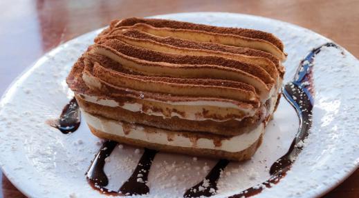 Tiramisu · Italian cookies (lady fingers) with thick layers of mascarpone cheese and espresso topped with cocoa powder.