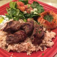 Lamb Kabobs · Tender lamb marinated and grilled, served with yogurt/lebne sauce. Gluten free.
