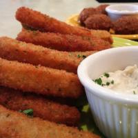 Zucchini Fries · Crispy fried sticks with tahini for dipping!