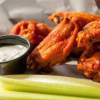 Chicken Wings  · Ten jumbo wings tossed in your choice of sauces. Served with celery and either smoked ranch ...