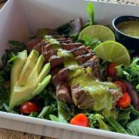 Chimichurri Steak Salad · House-made chimichurri drizzled over flat iron steak, grilled onion & asparagus, cherry toma...