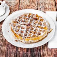 Pecan Waffle · Our golden Belgian waffle filled and topped with toasted pecans and dusted with powdered sug...