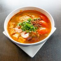 Bun Rieu  · Rice noodle, shrimp, pork blood, tomatoes and tofu. Garnish with green onion, cilantro and f...