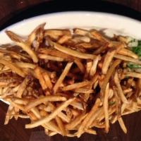 Munchie's Palomilla · Cuban cut steak topped with a mountain of natural French Fries.