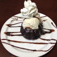 Volcan de Chocolate · Warm Molten Cake with vanilla ice cream.