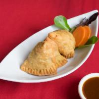 2. Vegetables Samosa · 2 pieces. Deep fried pastry stuffed with spiced potatoes and green peas. Served with tamarin...