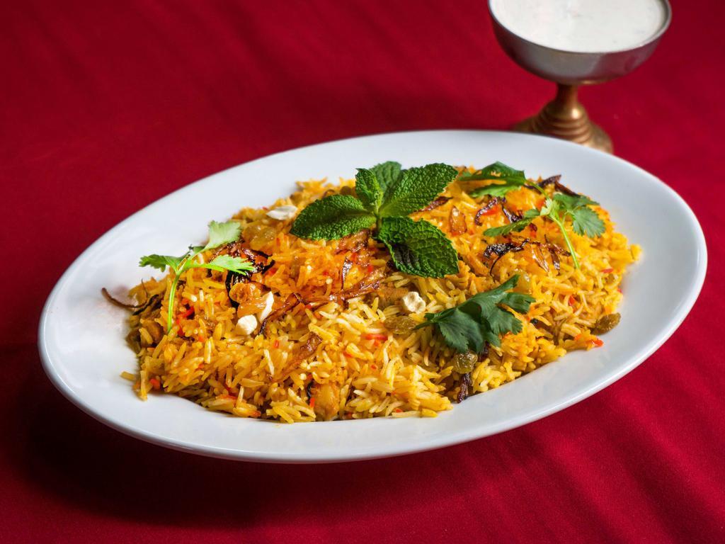 12. Chicken Biryani · Boneless chicken cooked with basmati rice in Himalayan herbs and spices.