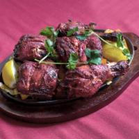 64. Chicken Tandoori · Bone-in chicken marinated in yogurt and Himalayan herbs and spices grilled in the tandoor ov...
