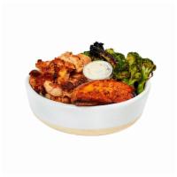 Classic Dig Bowl · Charred chicken, roasted sweet potatoes, charred broccoli with lemon, brown rice, garlic aio...