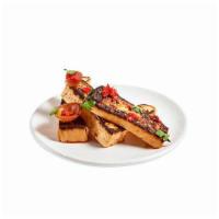 Grilled Tofu with Sriracha - Side · Tofu, roasted onion, pickled pepper relish, with sriracha on the side.  Vegan.  Contains soy.