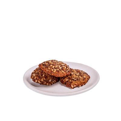 Kitchen Sink Cookie · Spiced oat cookie with flaxseed, grated carrot, raisins, and chocolate chips. Contains wheat/gluten, soy, milk, egg.