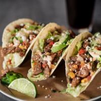 3 Street Tacos · Topped with freshly-made roasted tomato and corn salsa, shredded lettuce, avocado, fresh cil...