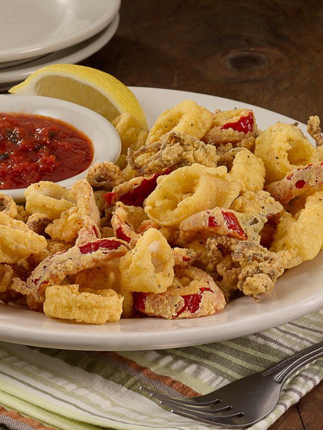 Calamari (Lg) · Tender, lightly breaded and friend with red cherry peppers, served with Prince marinara