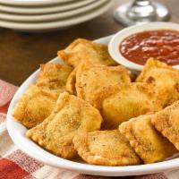 Toasted Ravioli (Lg) · Ricotta-filled ravioli, delicately handcrafted and fried, served with Prince marinara