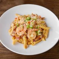 Creamy Shrimp Jambalaya · Gulf shrimp and chicken, crispy andouille sausage and penne pasta in a spicy creole sauce. T...