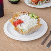 Tostada Salad · Beans, rice, lettuce, avocado, cheese, grilled chicken, tomato, and sour cream.