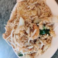 Pineapple Fried Rice · Rice stir-fried with beansprouts, broccoli, eggs, green onions, pineapple, yellow curry and ...