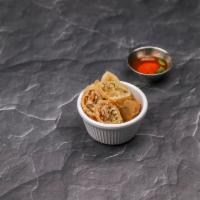 Egg Roll · 2 pieces. Vegetables and bean thread noodles rolled in crispy egg roll shell, served with ho...