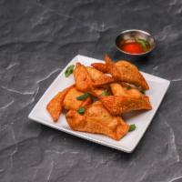 Crab Rangoon · 6 pieces. Wontons filled with cream cheese, imitation crab, green and yellow onions, served ...