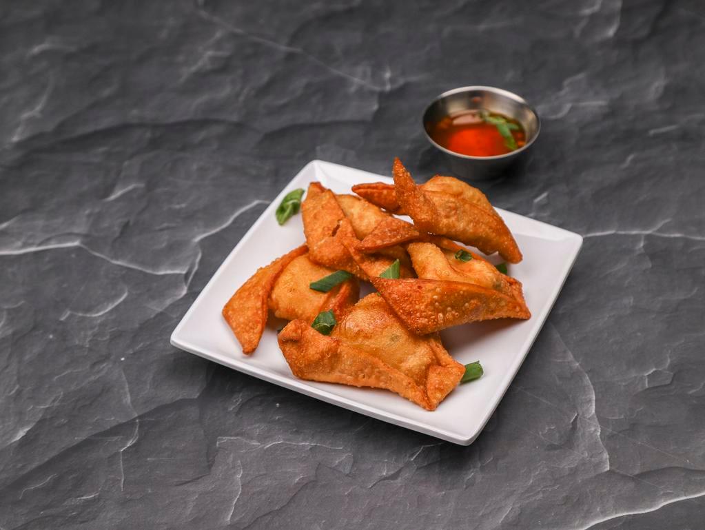 Crab Rangoon · 6 pieces. Wontons filled with cream cheese, imitation crab, green and yellow onions, served with house sweet and sour sauce.