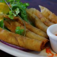 Fried Shrimp Rolls · 6 pieces. Shrimp and yellow onions, wrapped in crispy egg roll shell, served with house swee...