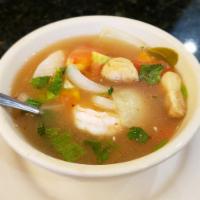 Tom Yum Goong Soup · Lemongrass soup with shrimp, tomatoes, yellow and green onions, mushrooms, kaffir leaves and...