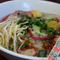 Pork Noodle Soup · Rice noodle soup with sliced pork and Chinese BBQ pork and bean sprouts, topped with fried g...