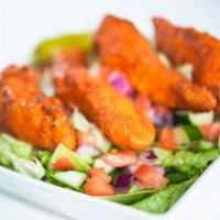 Buffalo Chicken Salad · Hand-breaded, fresh chicken tenders tossed in Buffalo sauce served on a garden salad.