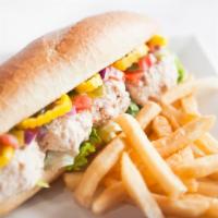 Tuna Classic Sub · Crisp lettuce, tomatoes, pickles, red onions and banana peppers.