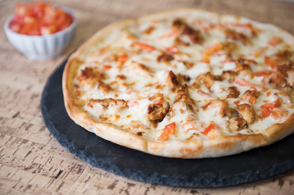 Grilled Chicken Bacon Ranch Pizza · Fresh grilled chicken and bacon swirled with ranch.
