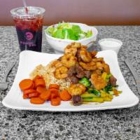 Steak, Chicken and Shrimp Teriyaki · Grilled with broccoli and zucchini in a sweet-citrus teriyaki sauce. Served over Japanese fr...