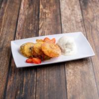 Apple Donuts · Lightly breaded and fried apples, vanilla ice cream, strawberries and caramel. Vegetarian an...