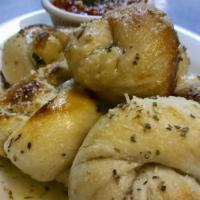 Garlic Knots · Smothered in our house garlic butter served with marinara.