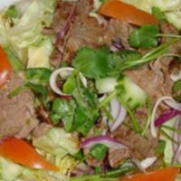Beef Salad · Grilled beef steak, onion, cilantro, tomatoes, cucumber, lemongrass, mixed with lime dressing.