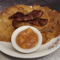 Potato Pancakes · Served with 2 strips of bacon and apple compote. Add sour cream for an additional charge.