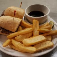 French Dip Sandwich · Thinly sliced beef piled on a fresh grilled French roll. Includes Au jus.