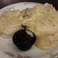 Hot Roast Turkey Sandwich · Roasted in house and hand carved turkey slices served open faced with mashed potatoes and gr...
