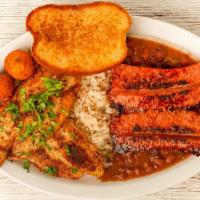 Cajun Special · White Rice Topped with 2 Catfish Fillets & Grilled Sausage + One Side