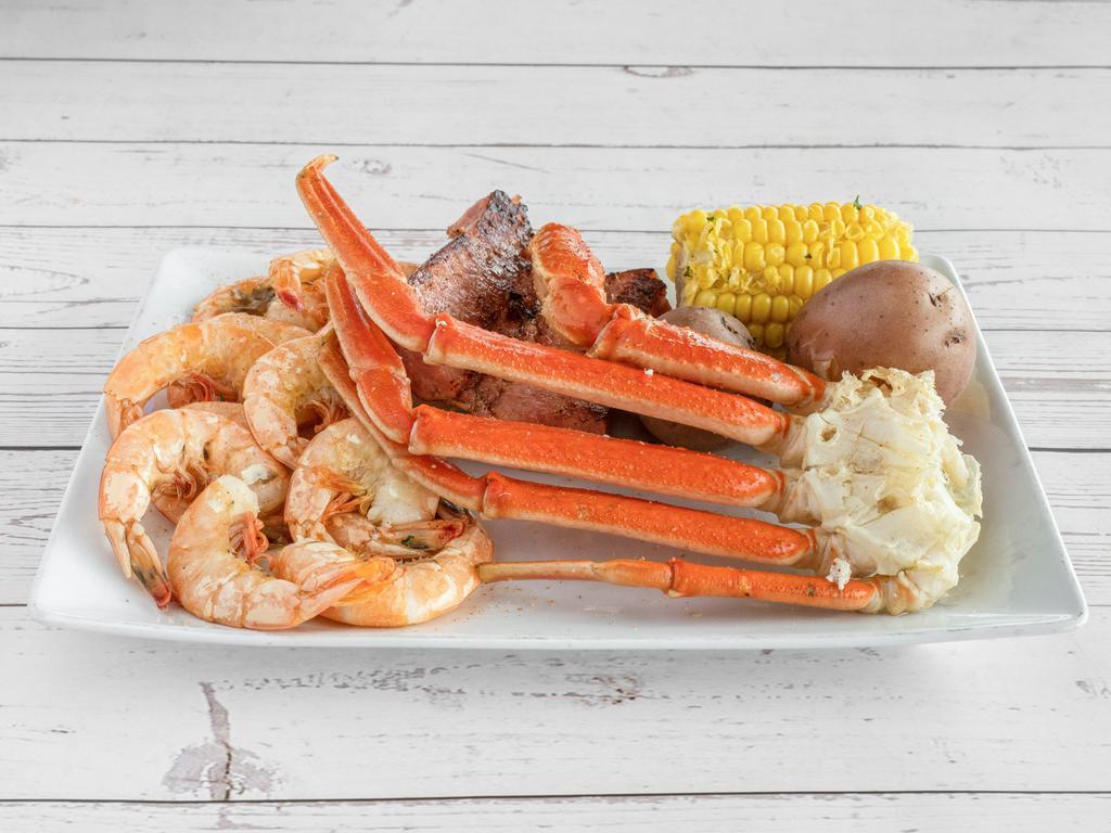 The Catch Boil · 1/2 Pound of Snow Crab, 1/2 Pound of Boiled Shrimp, 1/2 Pound of Sausage with Corn & Potatoes