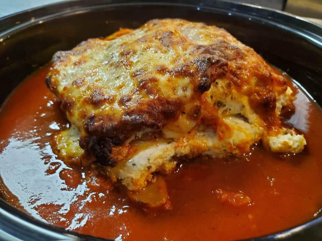 Lasagna  · Homemade layered pasta with bolognese sauce, ricotta, parmesan, and mozzarella cheese.