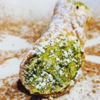 Cannoli · Fresh cream filled shell with pistachio dust.
